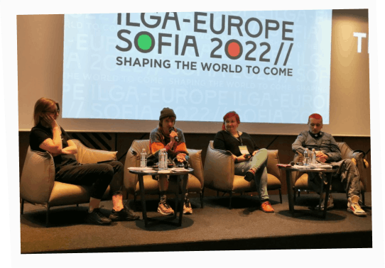 Salvador Stryzh speaking on a discussion panel at ILGA-Europe 2022 in Sofia
