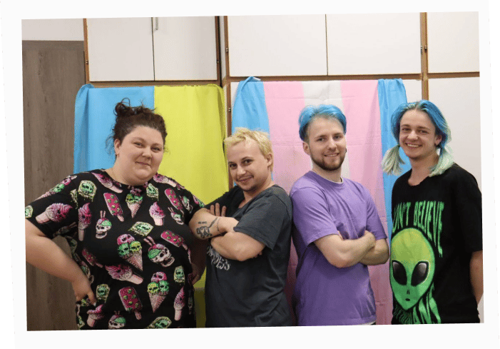 Founders of the Resistance initiative group posing with Ukrainian and transgender flags