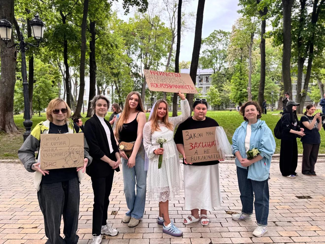 Protesters from various organizations holding signs opposing the proposed new Civil Code